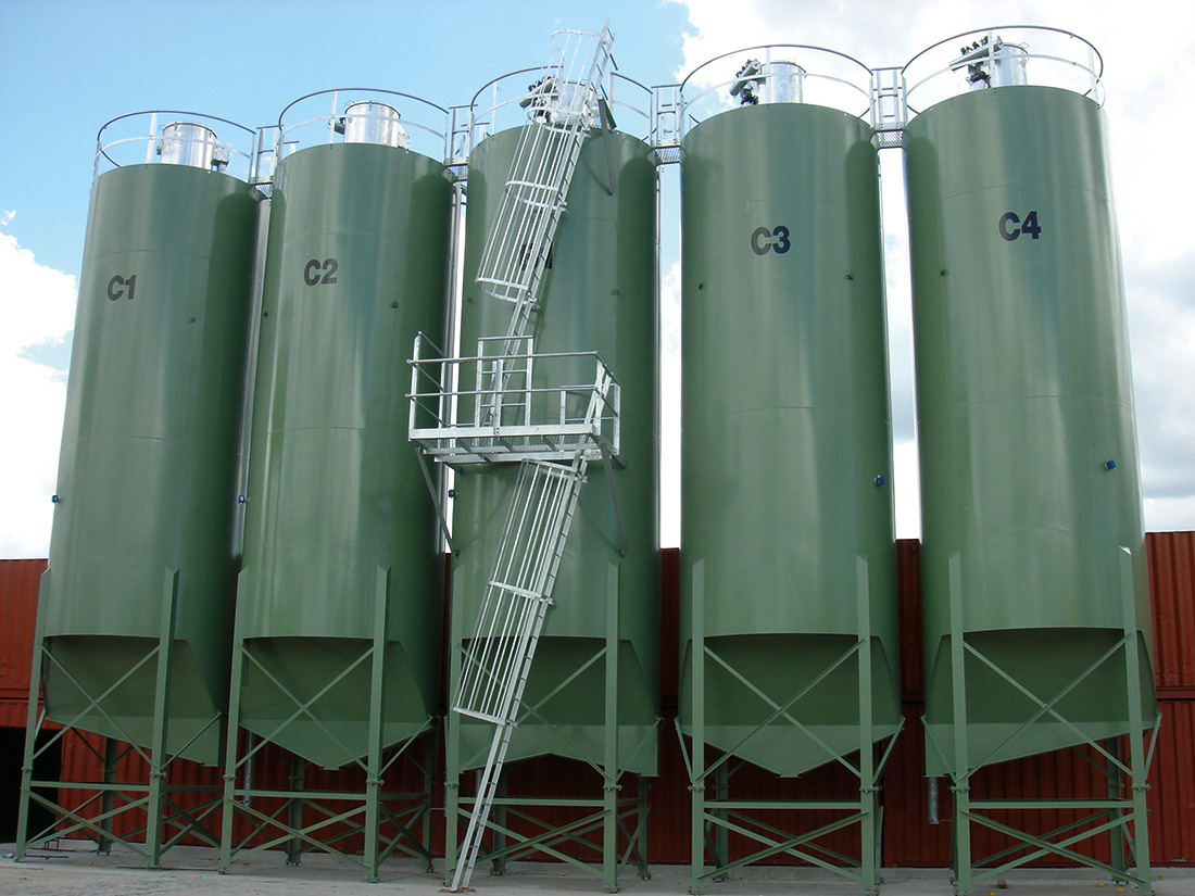 Row of cement storage silos | Featured image for the Cement Storage Silos landing page for CMQ Engineering AUS.
