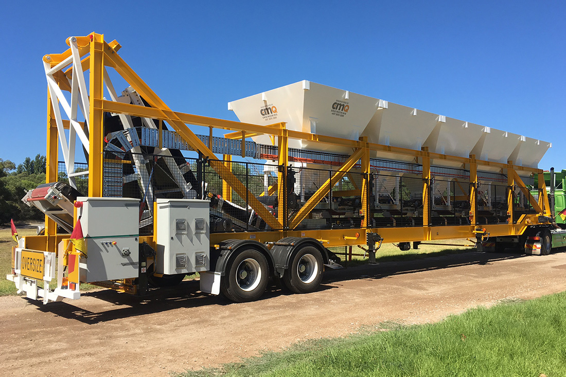 Color photo of a mobile aggregate trailer | Featured image for the Aggregate Weigh Trailer Page for CMQ Engineering.