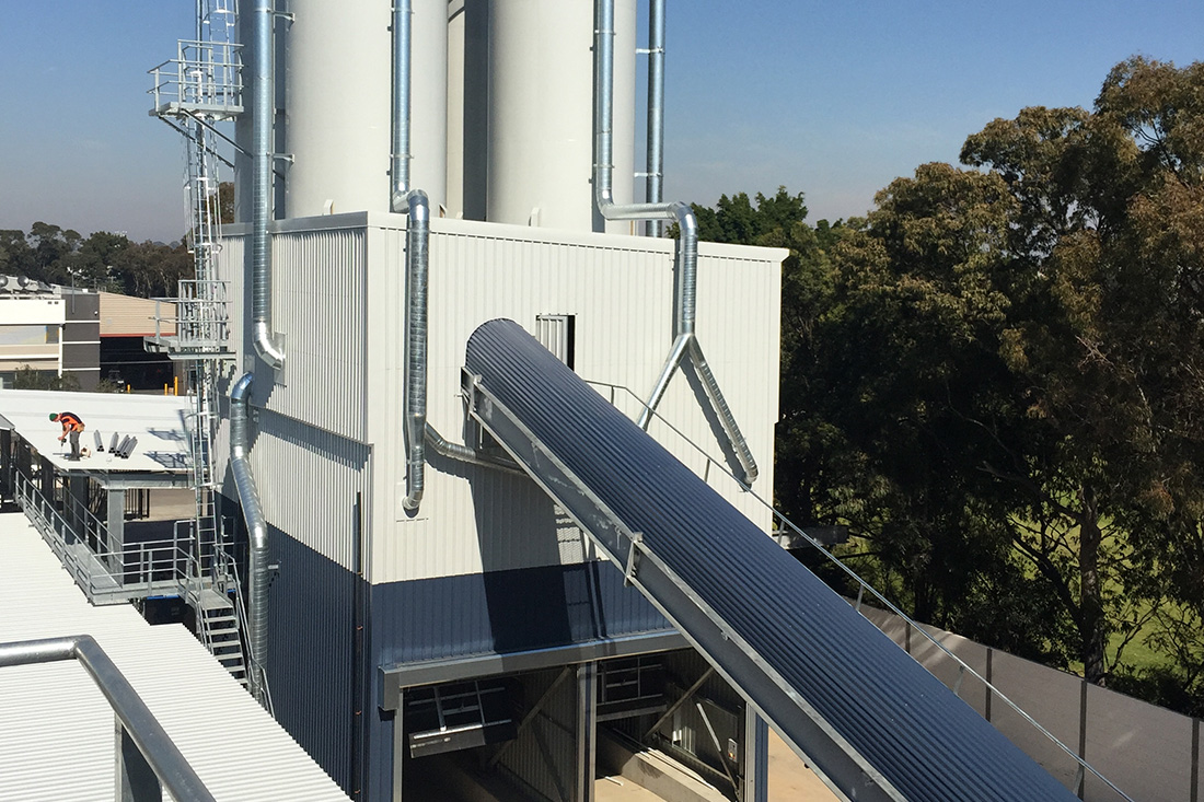 Photo of an external view of a conveyor system | featured image for Conveyors.