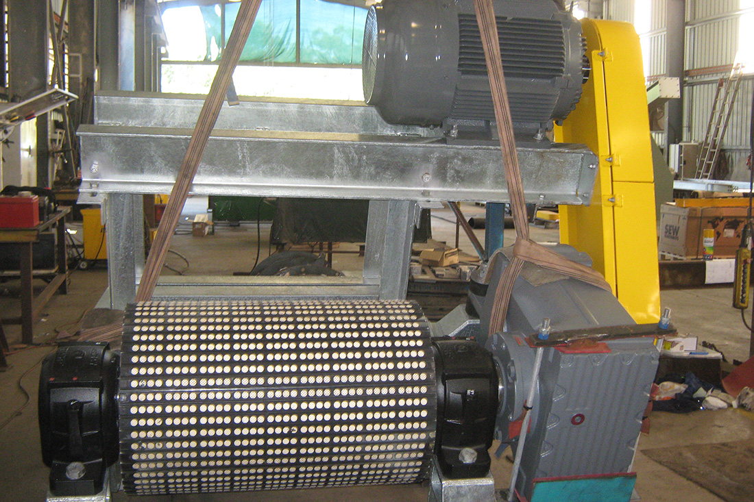 Photo of a conveyor and its engine inside a facility | featured image for Conveyors.