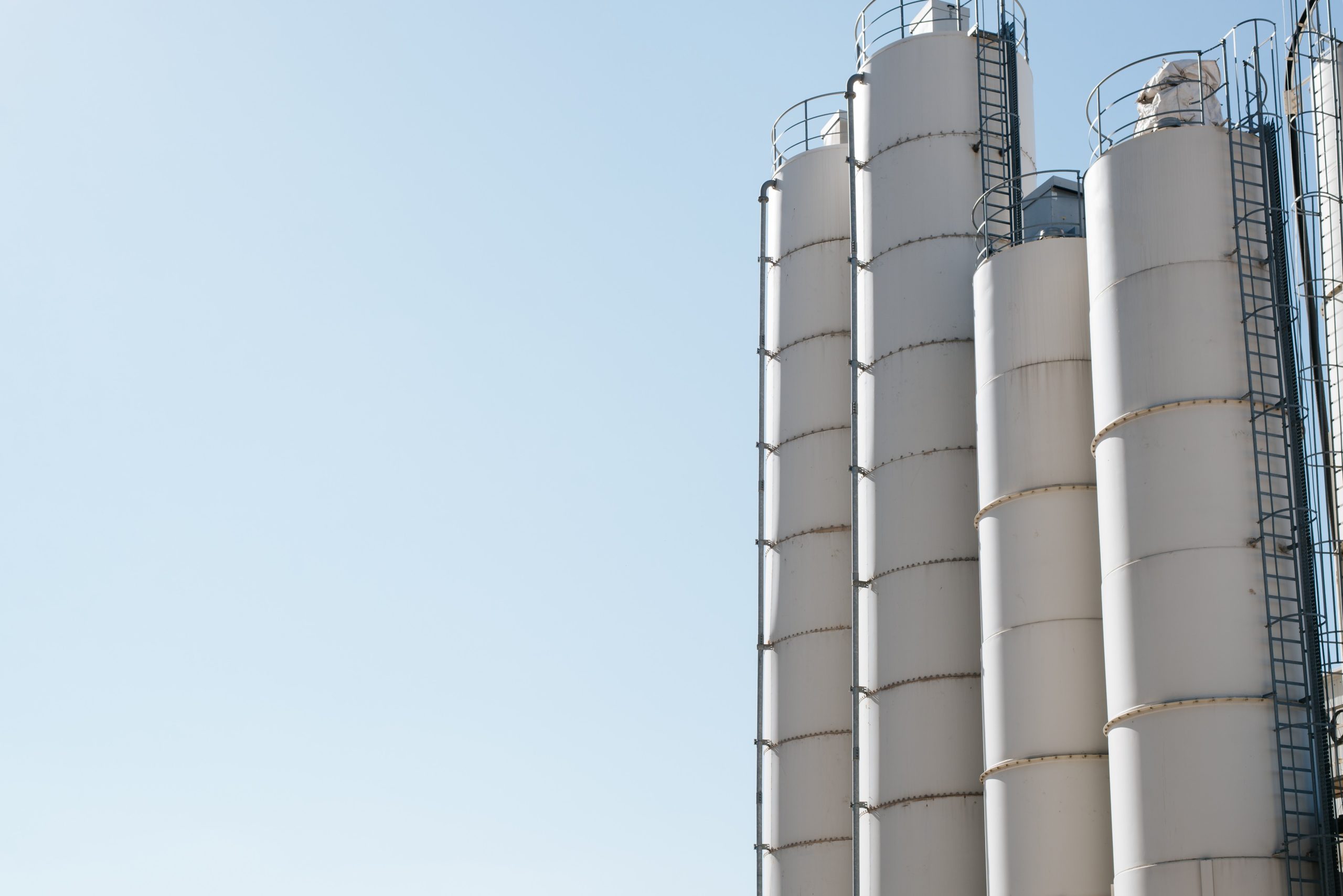 Row of cement silos | Featured image for the What are Concrete Silos Used For blog for CMQ Engineering AUS