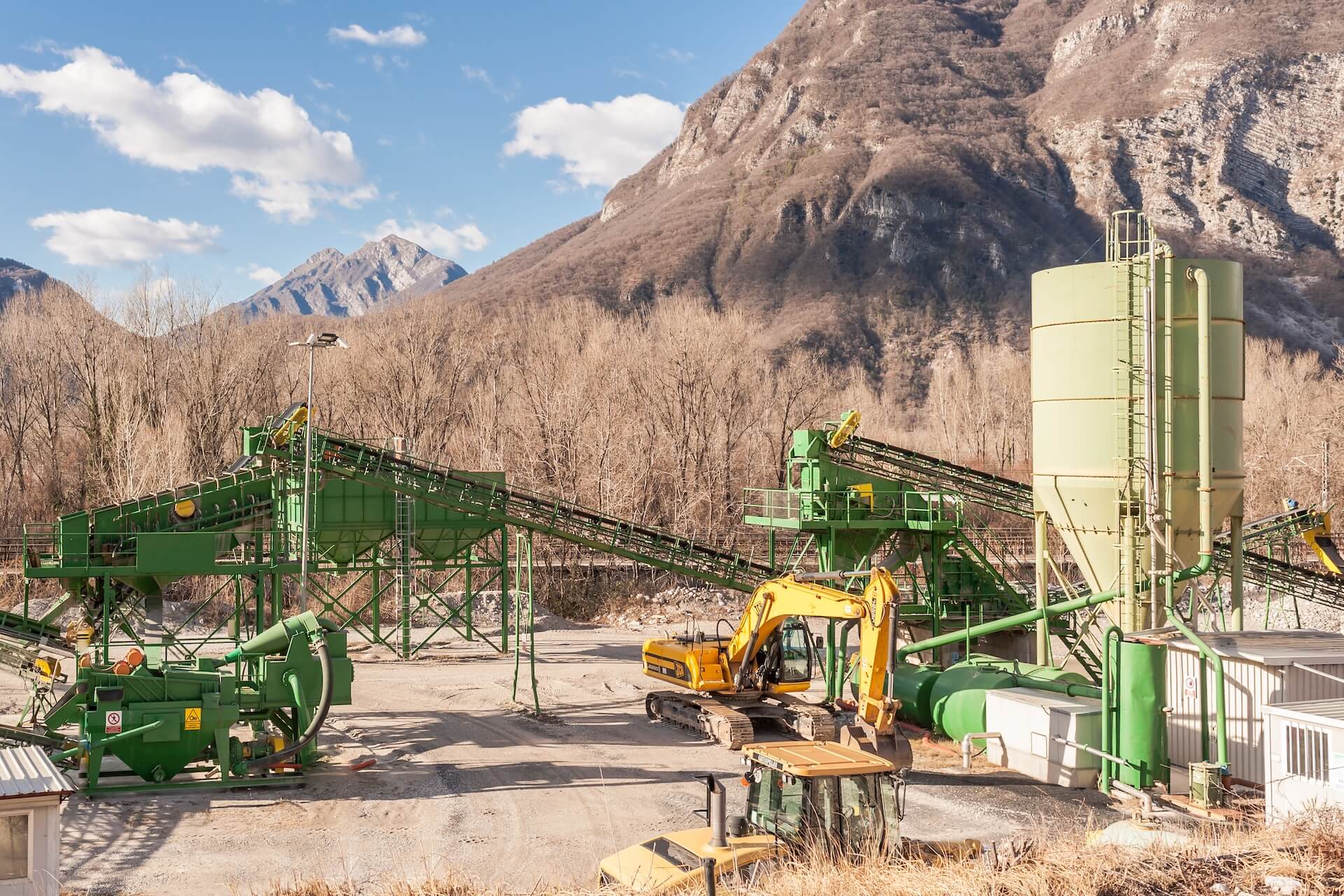 Gravel site with an active pugmill | Featured image for the What is a Pugmill and Why is it Important? blog on CMQ Engineering Australia.
