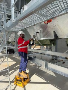 CMQ Engineering employee working on machinery